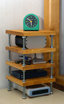 Small shelf made of wood and threaded rod